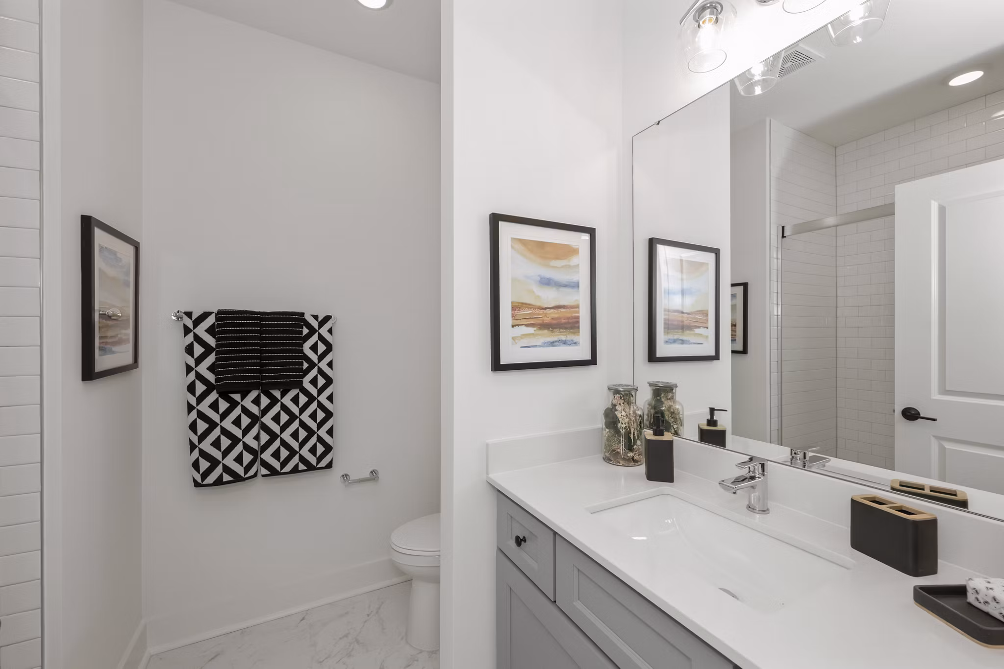 Modern bathroom featuring sleek fixtures and ample storage at Cascadia at Highland Creek Apartments