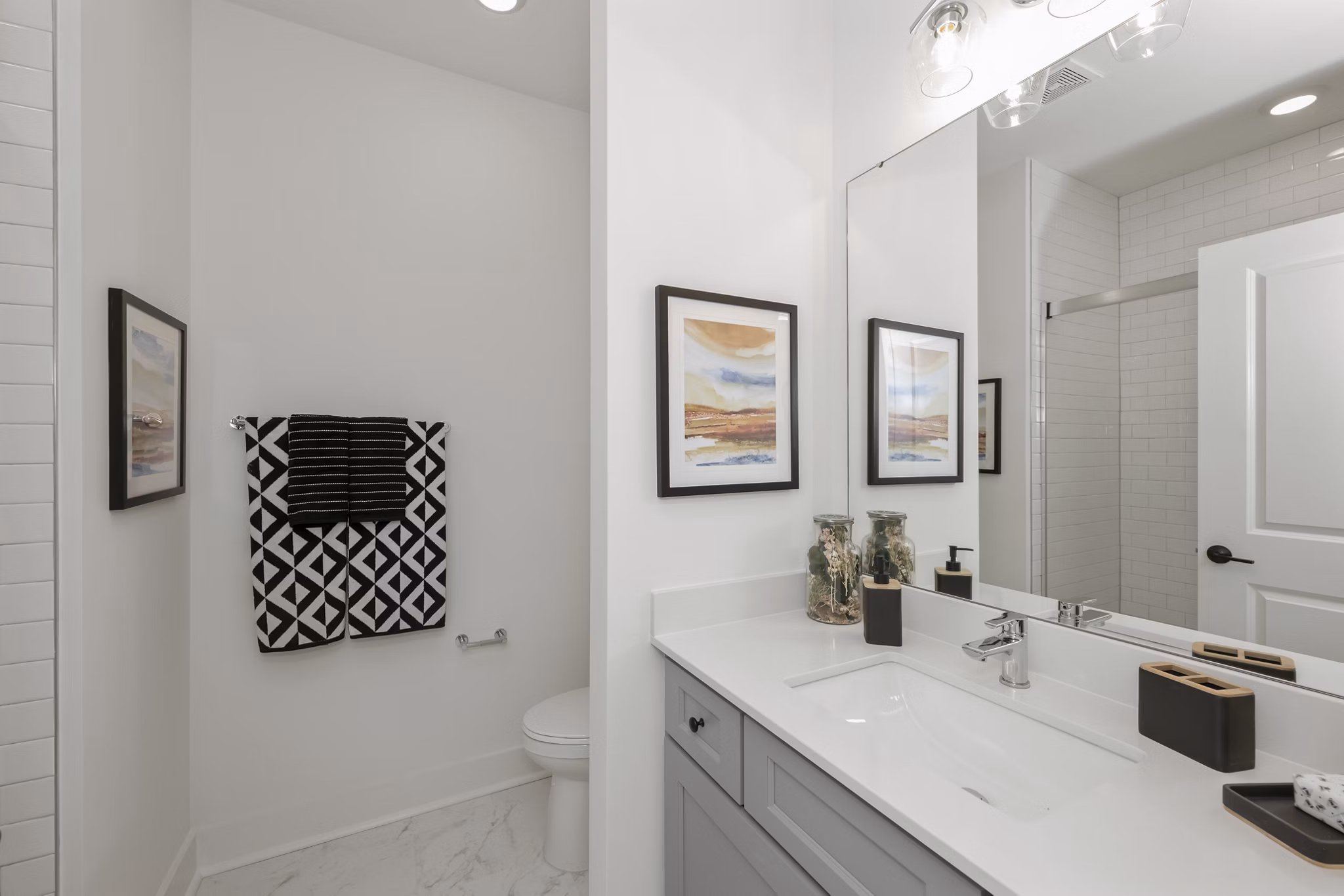 Modern bathroom featuring sleek fixtures and ample storage at Cascadia at Highland Creek Apartments