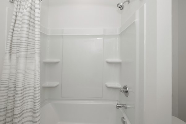 Modern bathroom with sleek fixtures in Cascadia at Highland Creek Apartments