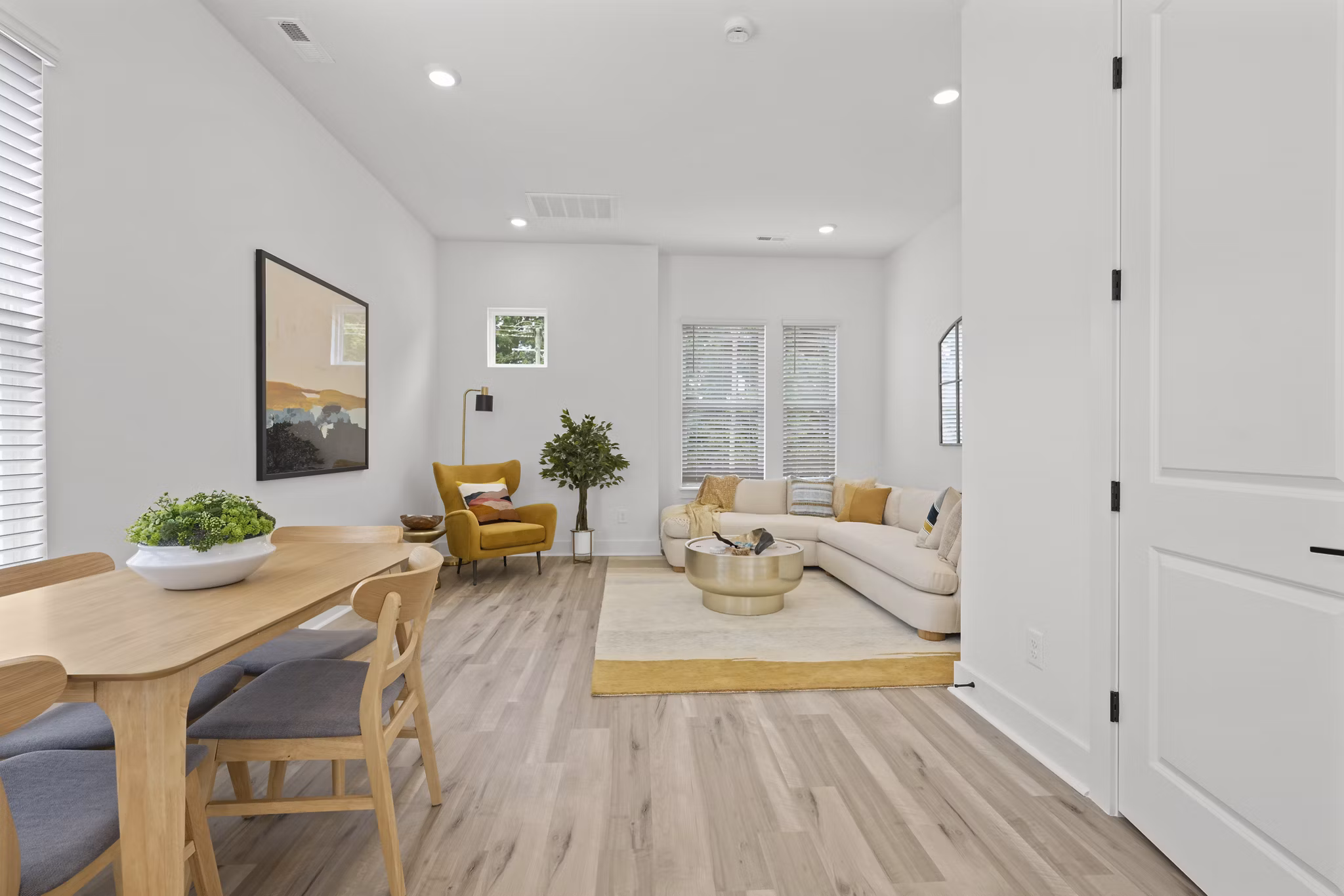 Dining area with modern furnishings at Cascadia at Highland Creek Apartments, offering a luxurious lifestyle