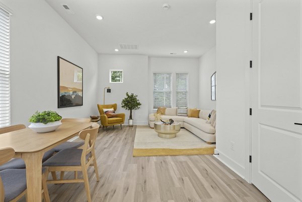 Dining area with modern furnishings at Cascadia at Highland Creek Apartments, offering a luxurious lifestyle