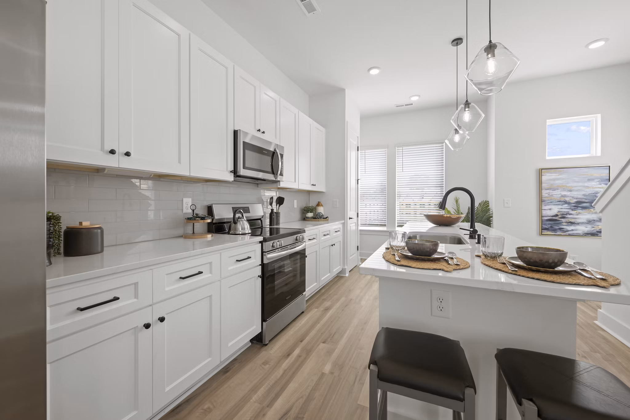 Cascadia at Highland Creek Apartments: Modern kitchen featuring sleek countertops and stainless steel appliances