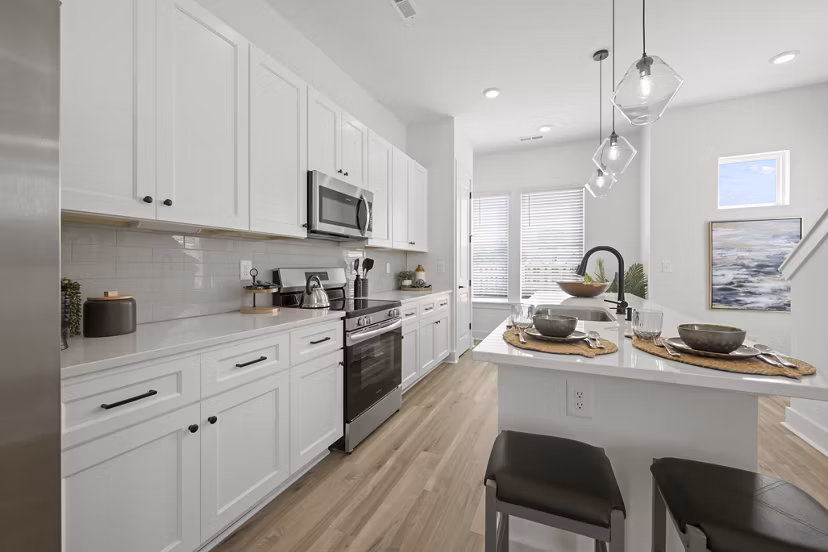 Cascadia at Highland Creek Apartments: Modern kitchen featuring sleek countertops and stainless steel appliances