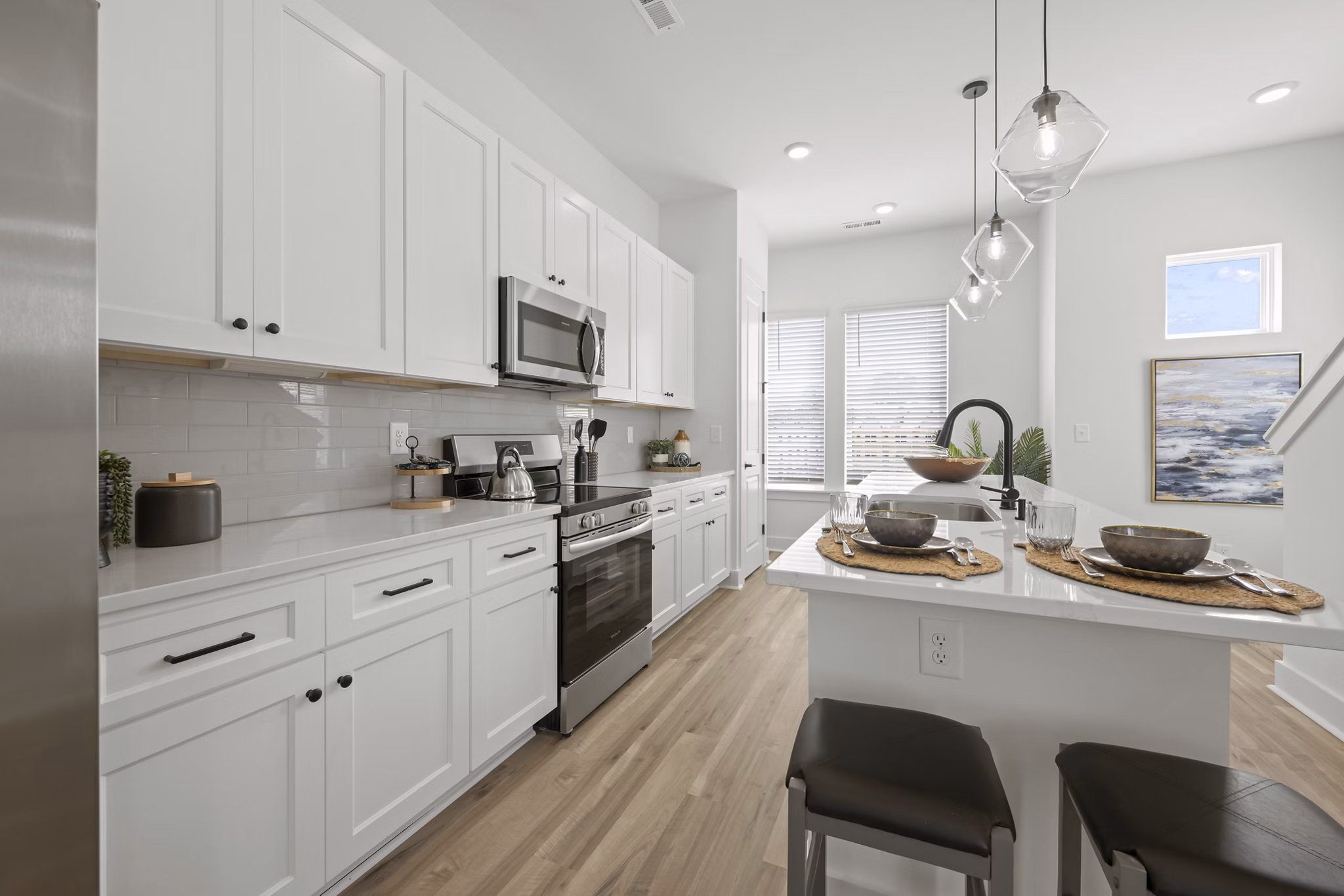 Cascadia at Highland Creek Apartments: Modern kitchen featuring sleek countertops and stainless steel appliances