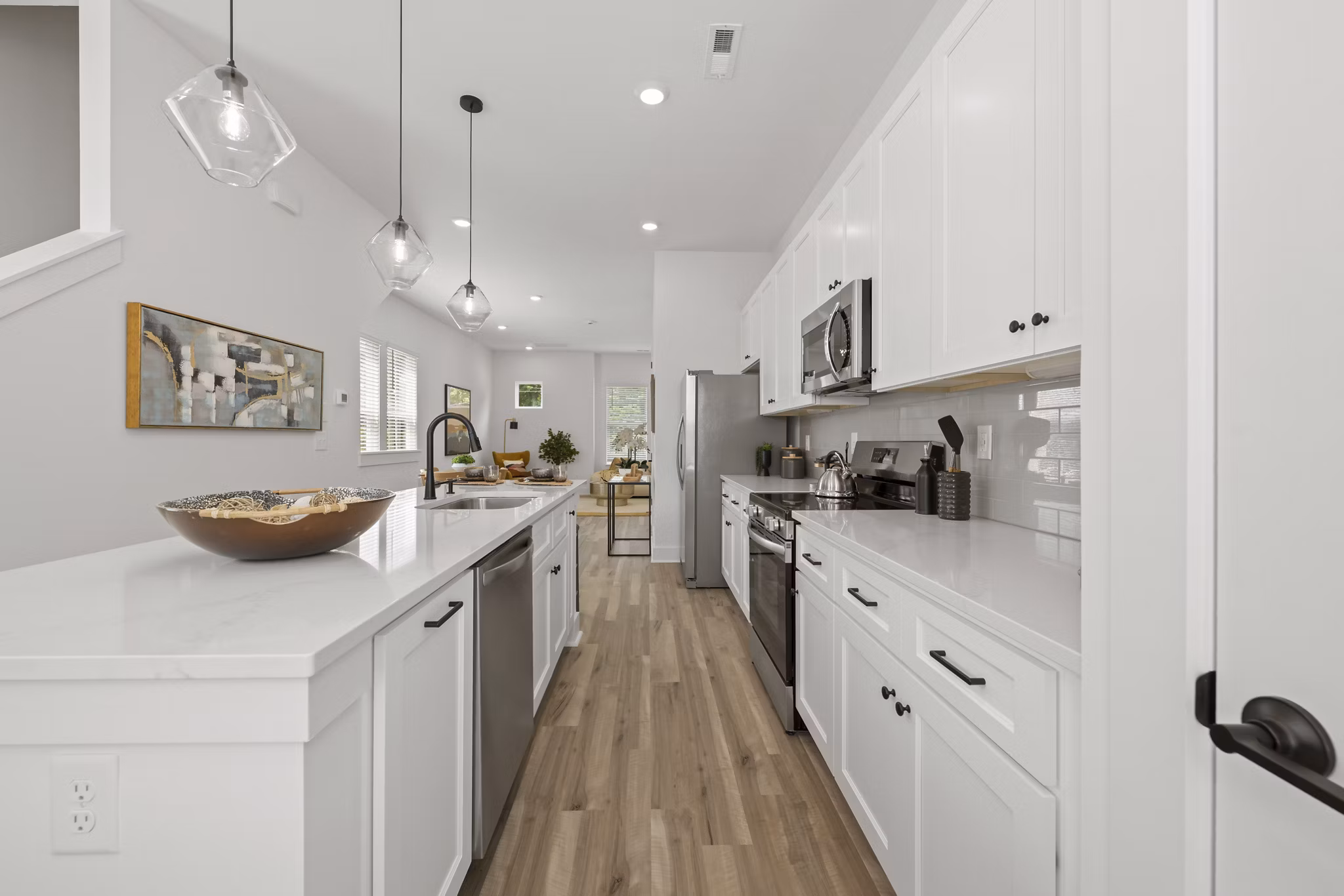 Modern kitchen with stainless steel appliances at Cascadia at Highland Creek Apartments