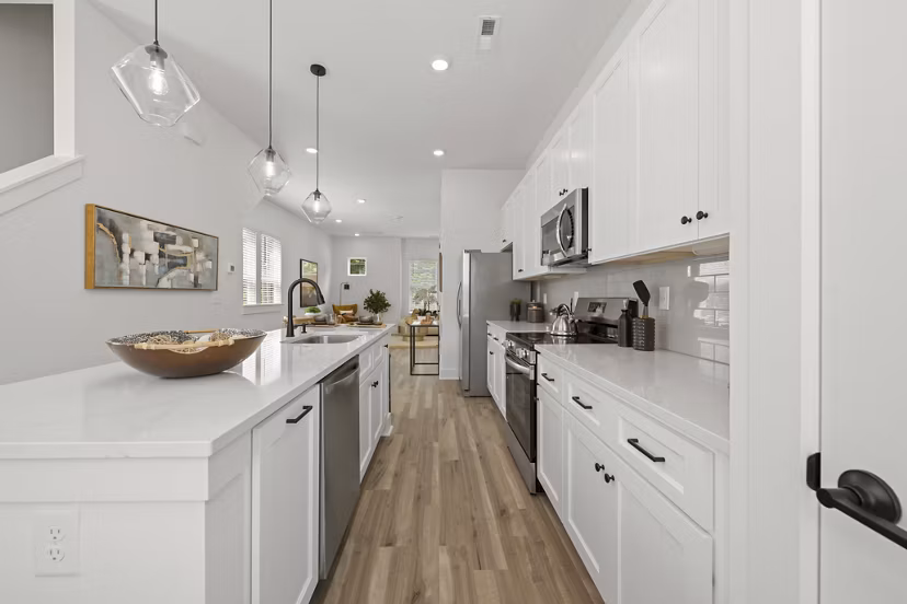 Modern kitchen with stainless steel appliances at Cascadia at Highland Creek Apartments