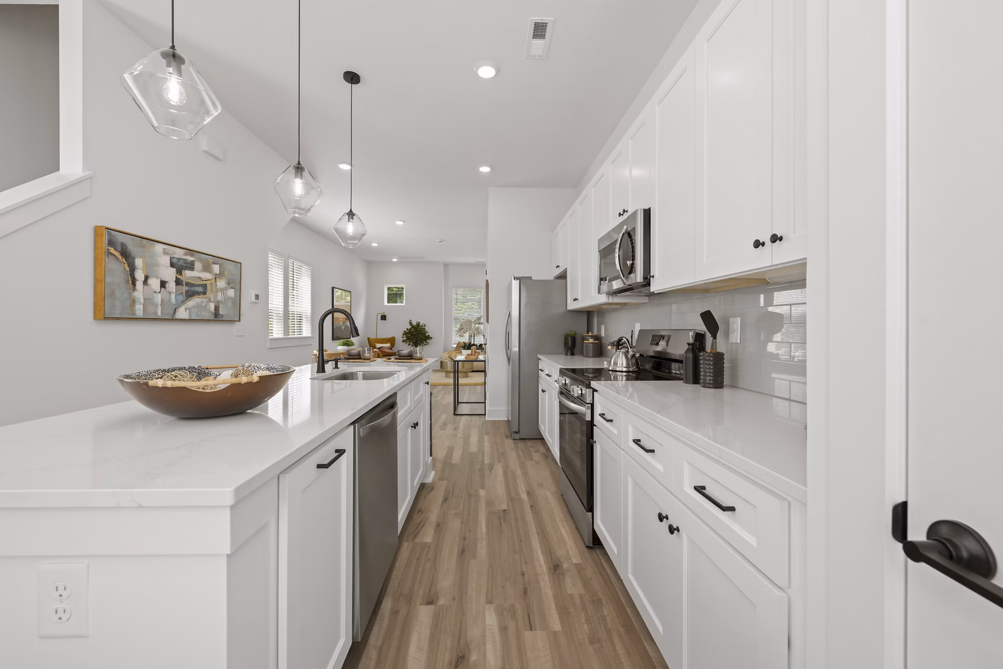 Modern kitchen with stainless steel appliances at Cascadia at Highland Creek Apartments