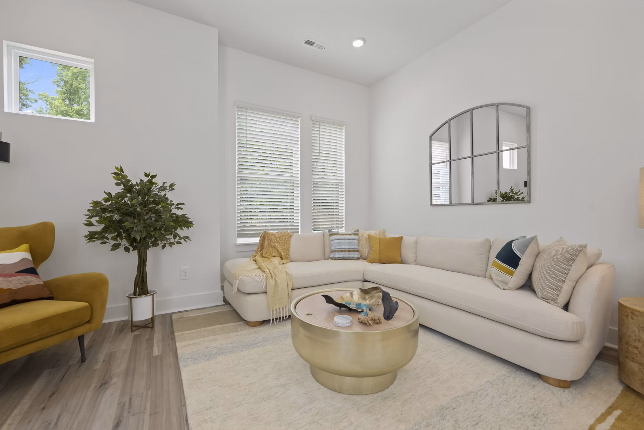 Spacious living room with modern dÃ©cor at Cascadia at Highland Creek Apartments