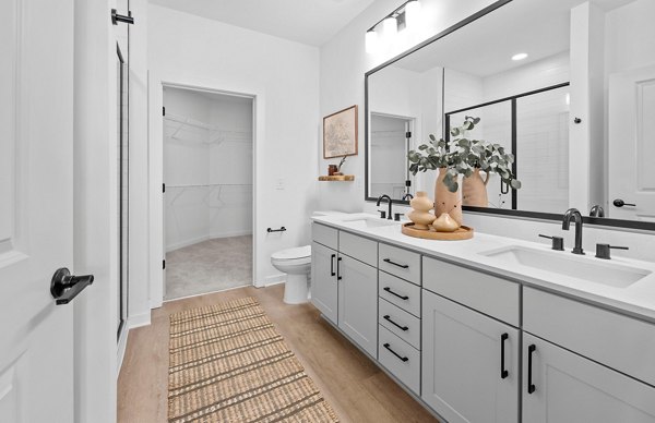 Luxurious bathroom with marble countertops at Elan Prosperity Village Apartments