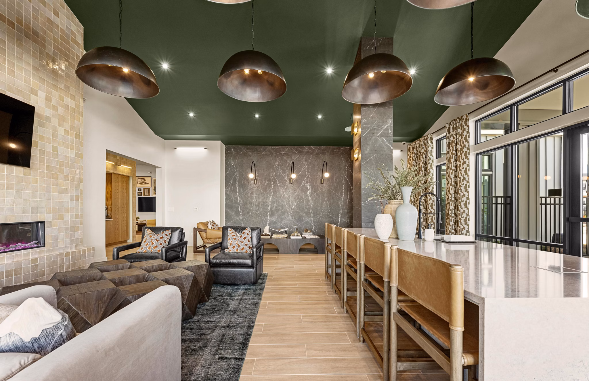 Clubhouse with modern design and outdoor seating at Elan Prosperity Village Apartments