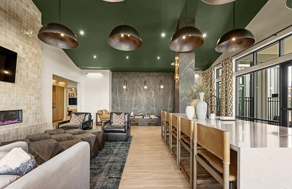 Clubhouse with modern design and outdoor seating at Elan Prosperity Village Apartments