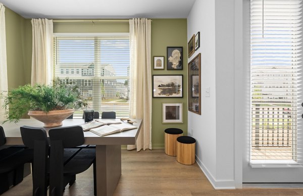 Home office with ergonomic chair and large desk at Elan Prosperity Village Apartments