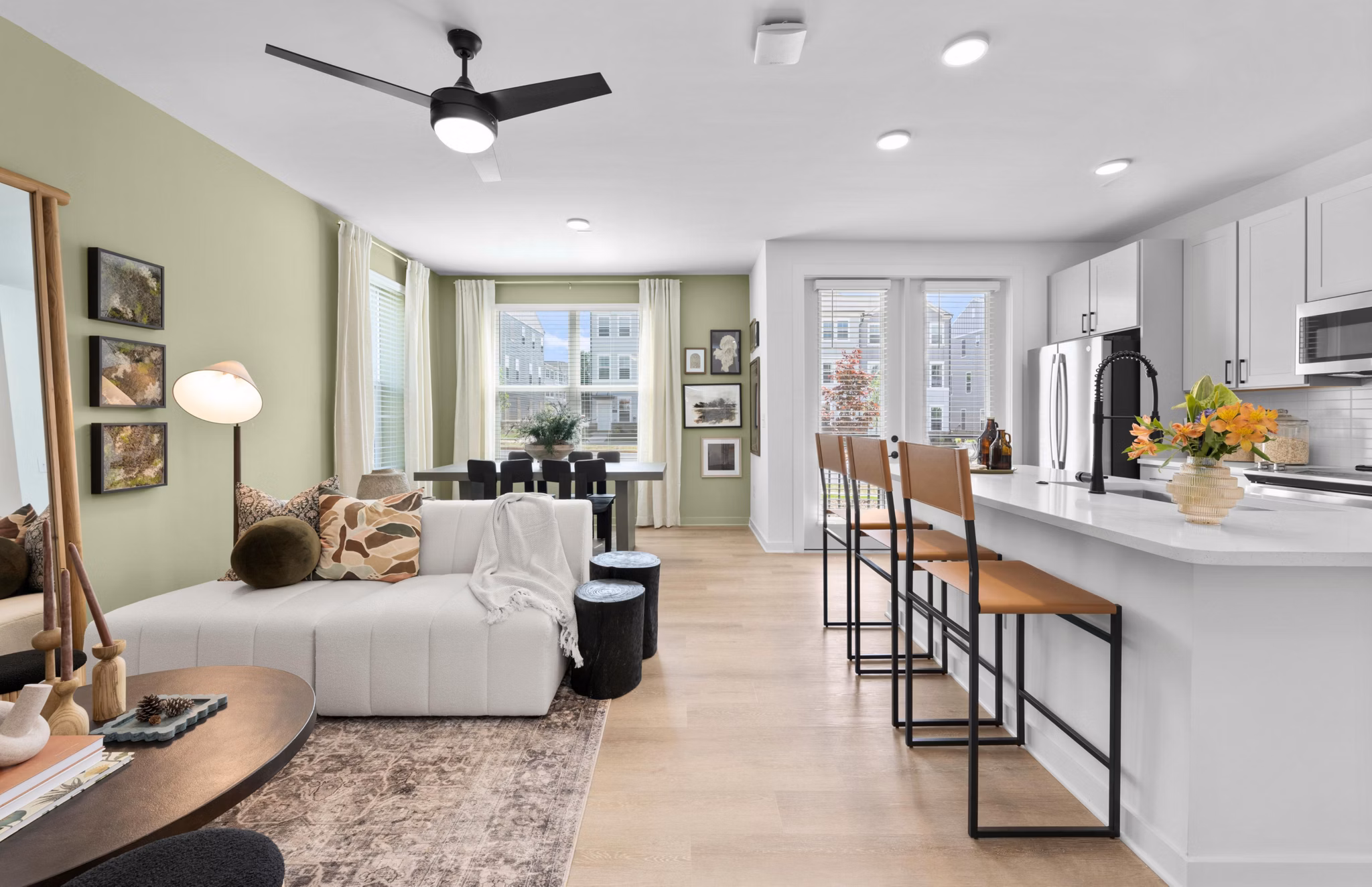 Modern kitchen with granite countertops and stainless steel appliances in Elan Prosperity Village Apartments