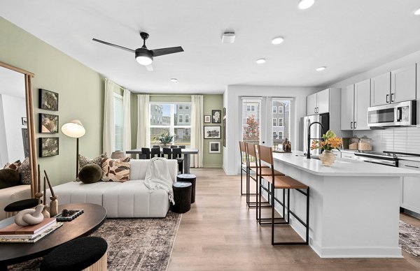 Modern kitchen with stainless steel appliances at Elan Prosperity Village Apartments