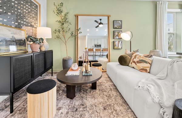 Spacious living room with modern decor at Elan Prosperity Village Apartments