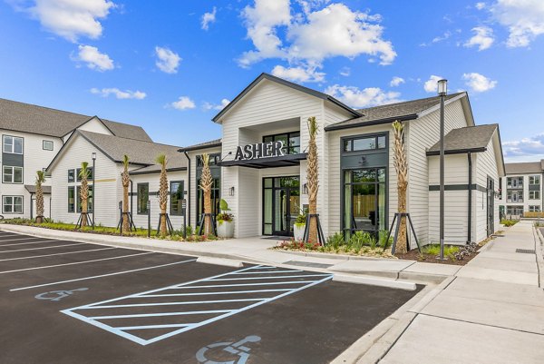 Asher Apartments: Contemporary clubhouse with open seating and modern decor, perfect for resident gatherings and community events