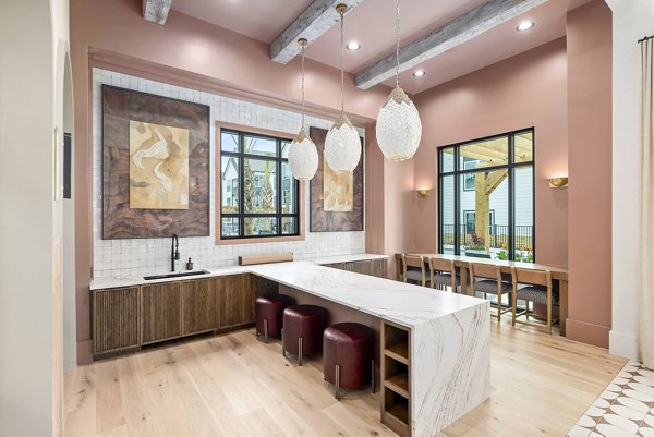 Clubhouse featuring modern seating and entertainment space at Asher Apartments