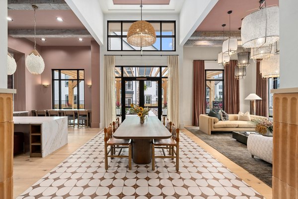 Clubhouse meeting facility with modern seating and AV equipment at Asher Apartments