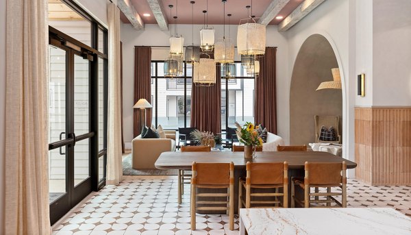 Meeting facility with modern design and ample seating at Asher Apartments clubhouse
