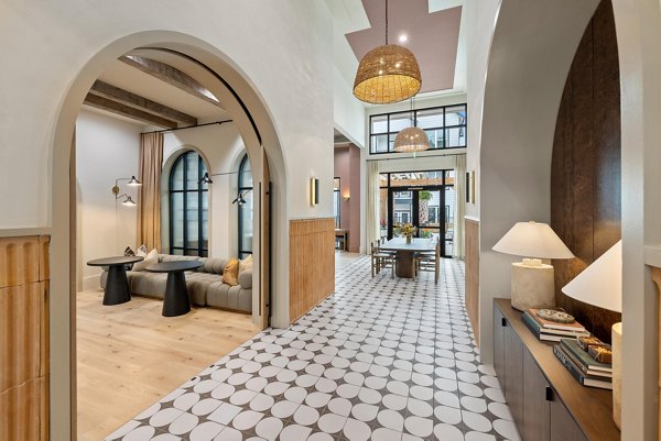 Clubhouse meeting facility at Asher Apartments with modern furnishings and collaborative spaces for luxury living
