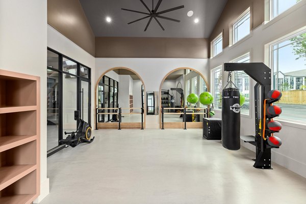 Fitness center featuring modern equipment at Asher Apartments