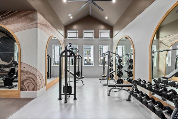 State-of-the-art fitness center with modern equipment at Asher Apartments