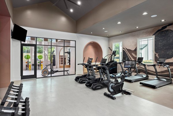 State-of-the-art fitness center with modern equipment at Asher Apartments for luxury living