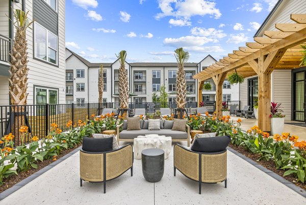 Outdoor patio with modern seating at Asher Apartments
