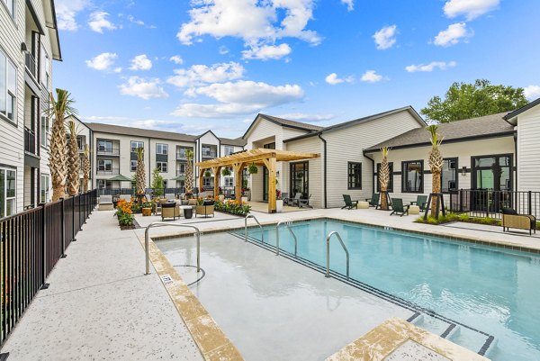 Luxury poolside relaxation area at Asher Apartments, a Greystar luxury property