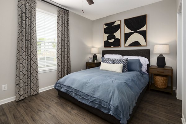 Cozy bedroom with elegant decor at The Mill at White House Apartments