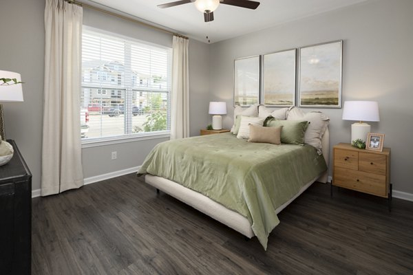 Cozy bedroom with modern decor at The Mill at White House Apartments