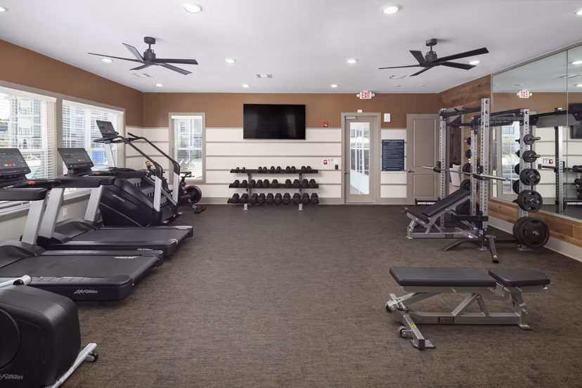 Modern fitness center with state-of-the-art equipment at The Mill at White House Apartments