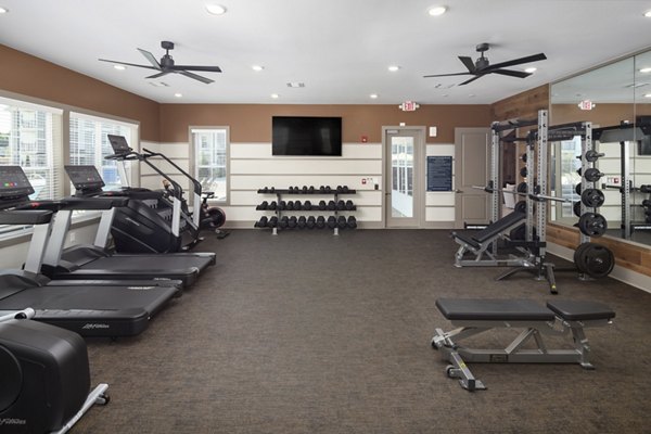 Modern fitness center with state-of-the-art equipment at The Mill at White House Apartments