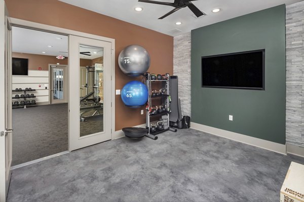 Yoga and spin studio with modern equipment at The Mill at White House Apartments, a luxury community offering wellness-focused amenities