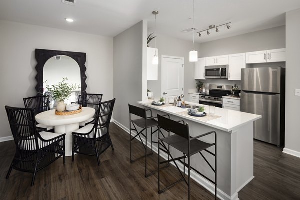 The Mill at White House Apartments: Modern kitchen with stainless steel appliances and granite countertops