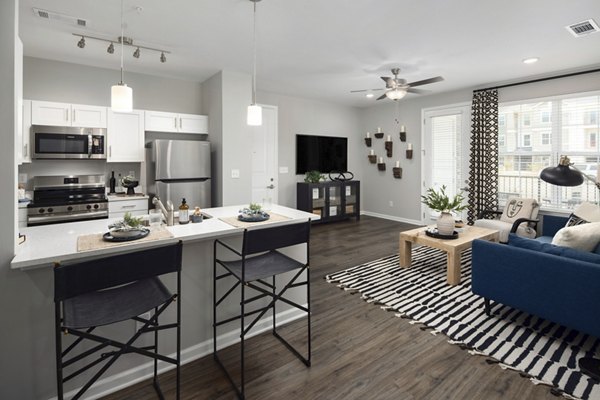 Modern kitchen with stainless steel appliances at The Mill at White House Apartments