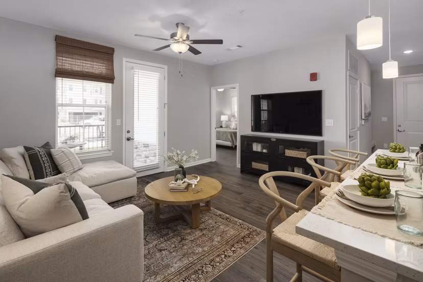 Stylish living room with modern decor at The Mill at White House Apartments, a luxury Greystar property