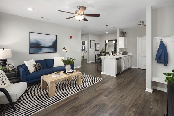 Spacious living room with modern furnishings at The Mill at White House Apartments, highlighting luxury living spaces