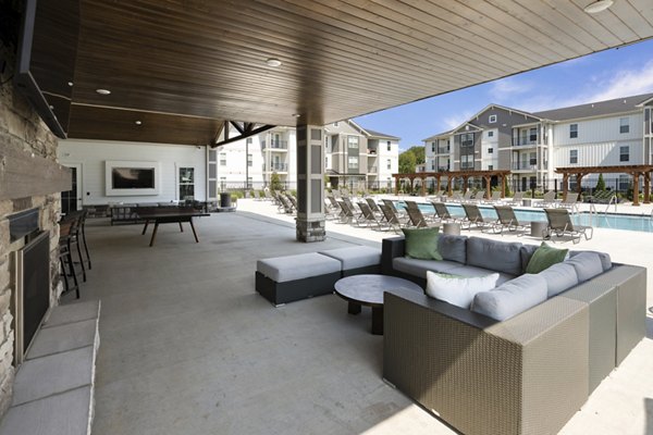 Spacious patio with seating area at The Mill at White House Apartments, perfect for outdoor relaxation