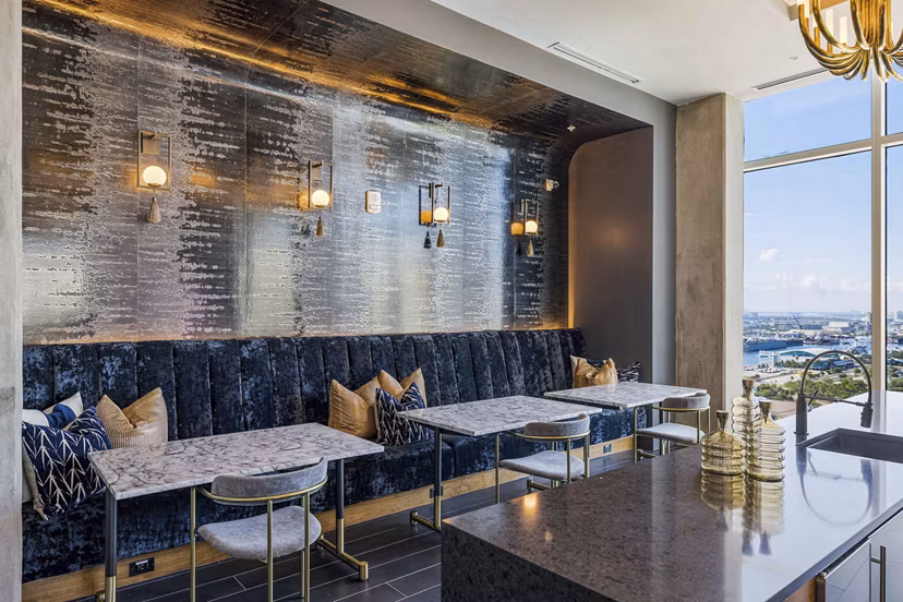 The MAV Apartments: Modern clubhouse with stylish seating and entertainment spaces in Greystar's luxury community