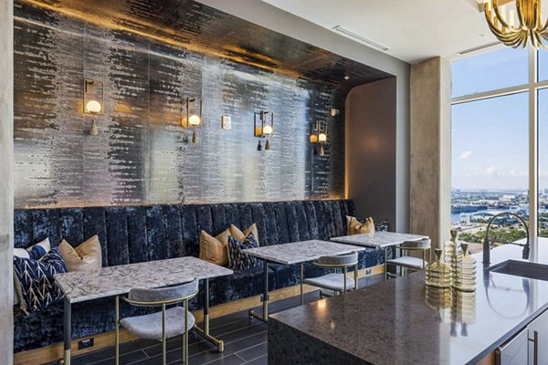 The MAV Apartments: Modern clubhouse with stylish seating and entertainment spaces in Greystar's luxury community