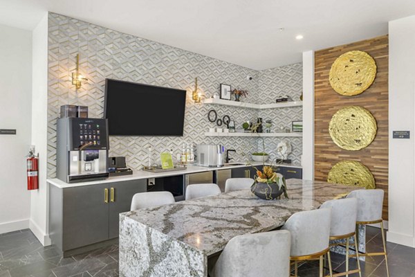 Clubhouse with modern design and cozy seating at The MAV Apartments