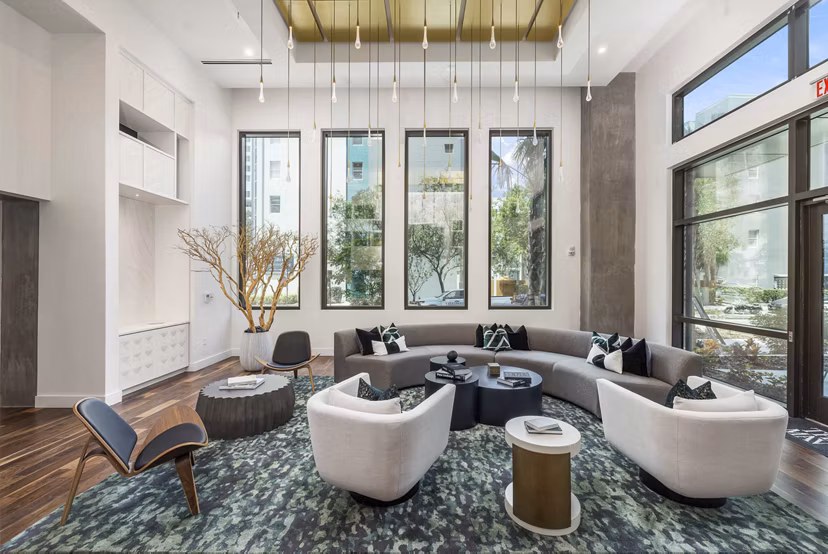Clubhouse featuring modern design and lounge seating at The MAV Apartments