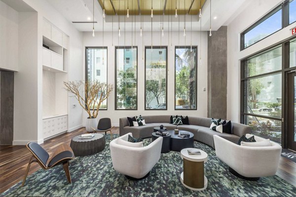 Clubhouse featuring modern design and lounge seating at The MAV Apartments