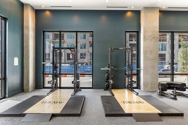Modern fitness center featuring state-of-the-art equipment at The MAV Apartments