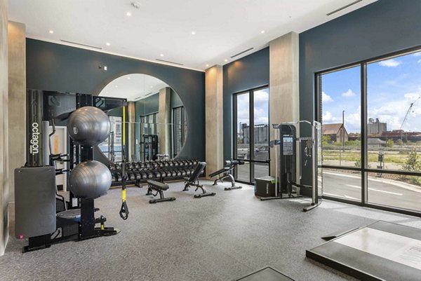 State-of-the-art fitness center with modern equipment at The MAV Apartments