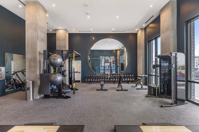 State-of-the-art fitness center with modern equipment at The MAV Apartments