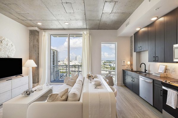 Modern kitchen with stainless steel appliances at The MAV Apartments