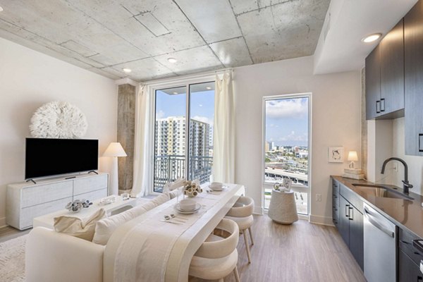 Modern kitchen with stainless steel appliances at The MAV Apartments