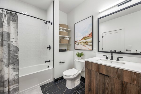 Anthem Everett Apartments: Modern bathroom with sleek fixtures and marble countertops in luxury apartment complex